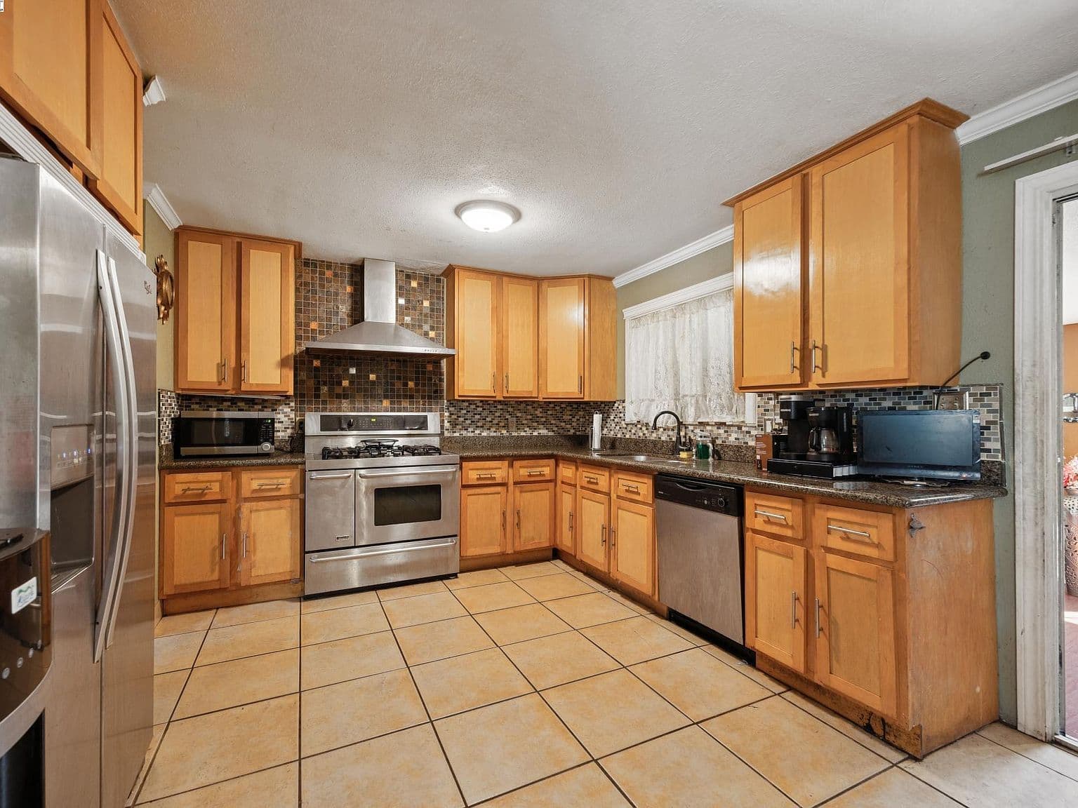 Dated Kitchen Cabinets and Backsplash